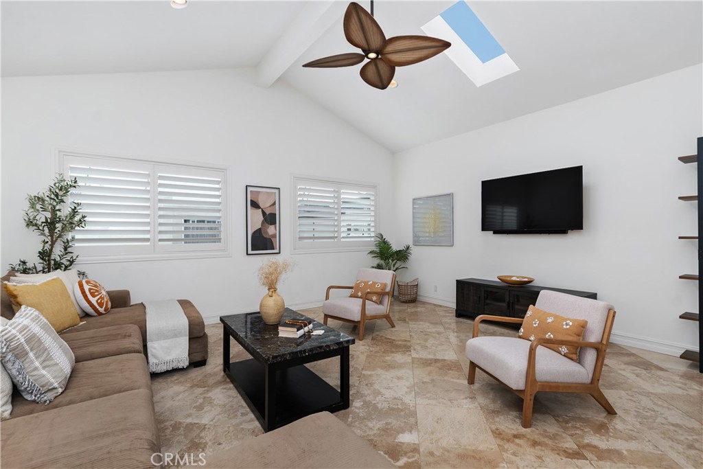 154 12th Street Seal Beach, CA 90740 - Photo 25 of 39 a living room with furniture and a flat screen tv