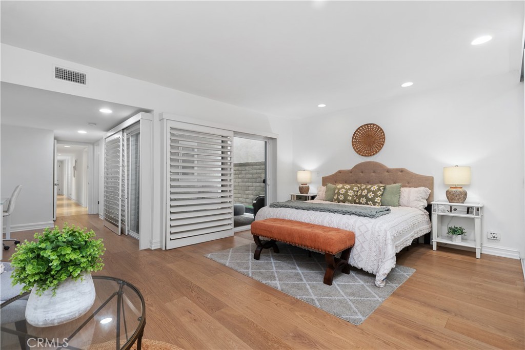 154 12th Street Seal Beach, CA 90740 - Photo 29 of 39 a bedroom with a bed and a chair