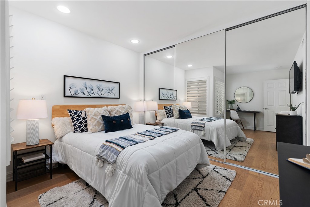 154 12th Street Seal Beach, CA 90740 - Photo 35 of 39 a bedroom with bed a couch and large window