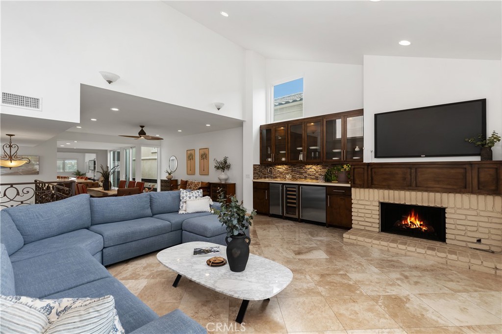 154 12th Street Seal Beach, CA 90740 - Photo 5 of 39 a living room with furniture and a fireplace