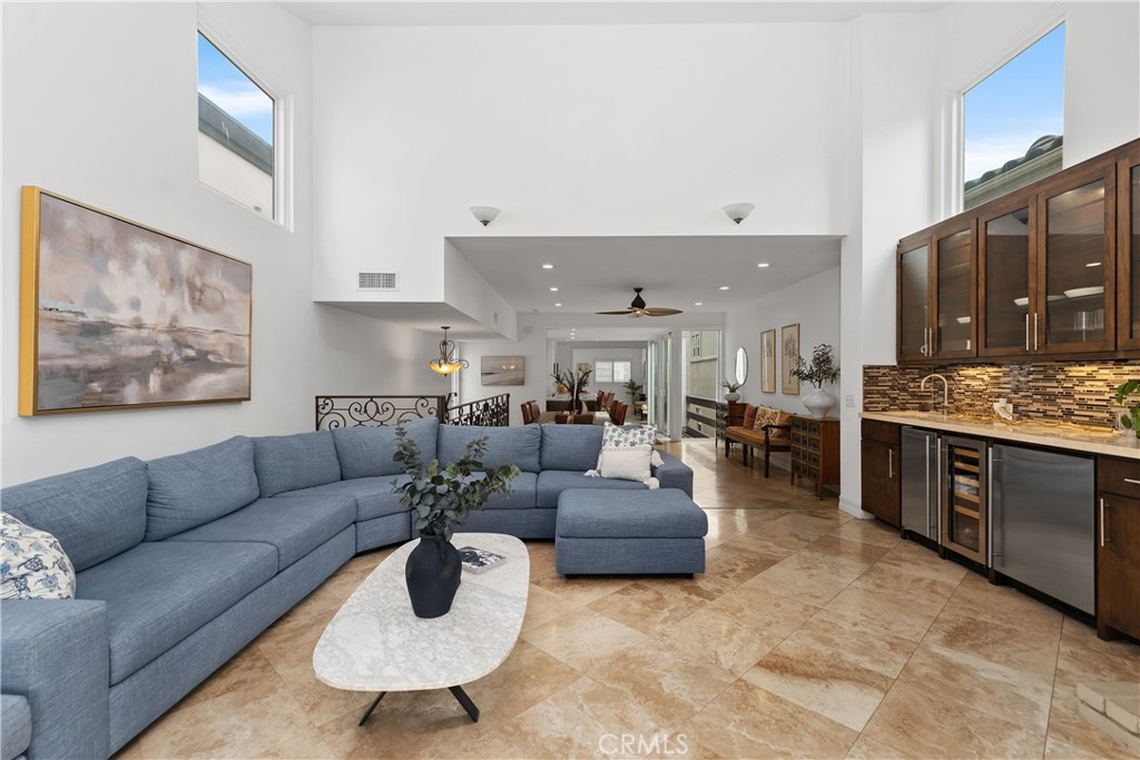154 12th Street Seal Beach, CA 90740 - Photo 7 of 39 a living room with furniture and a kitchen