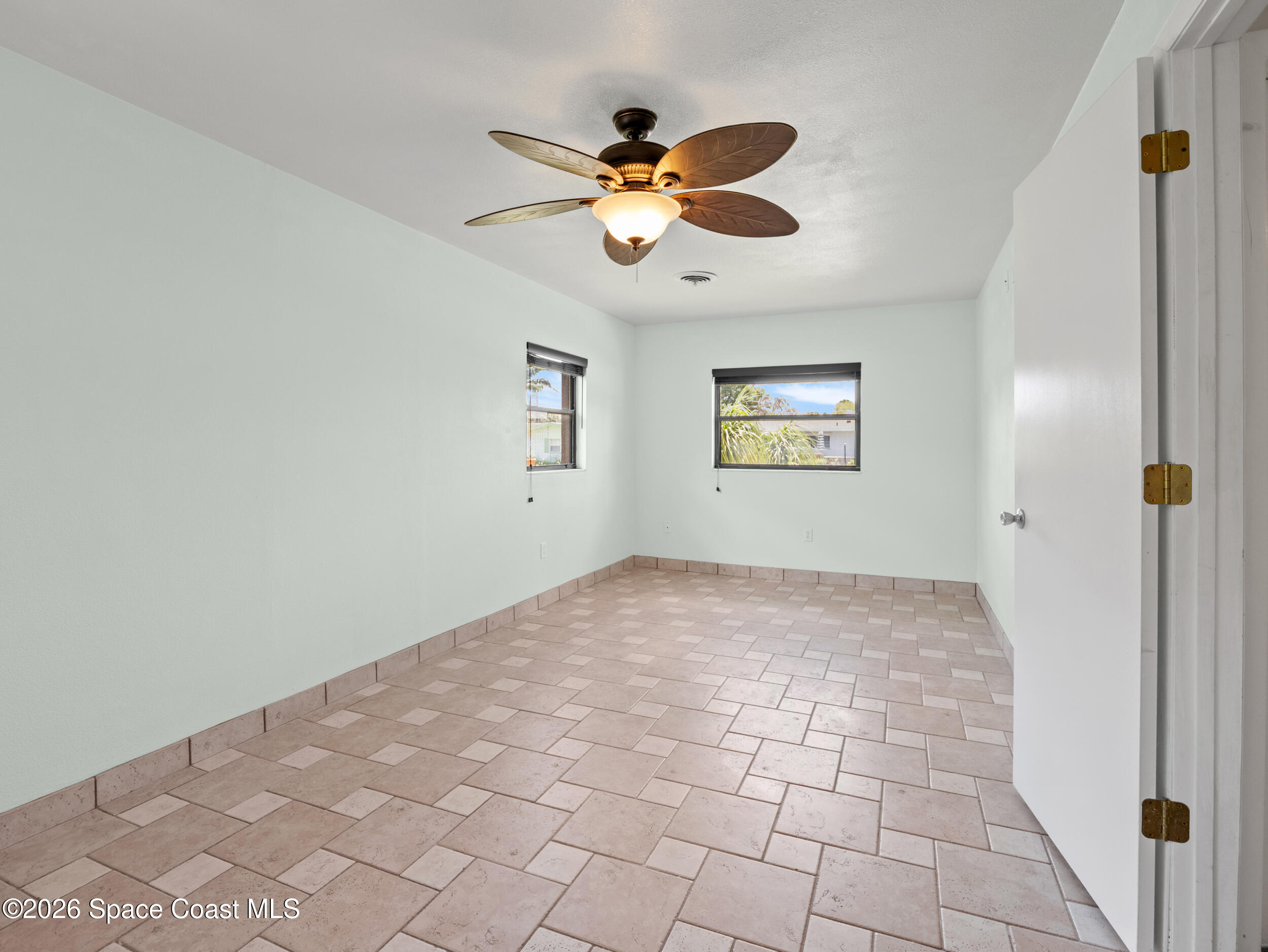 406 Amherst Avenue Melbourne, FL 32901 - Photo 21 of 36 a view of an empty room and window
