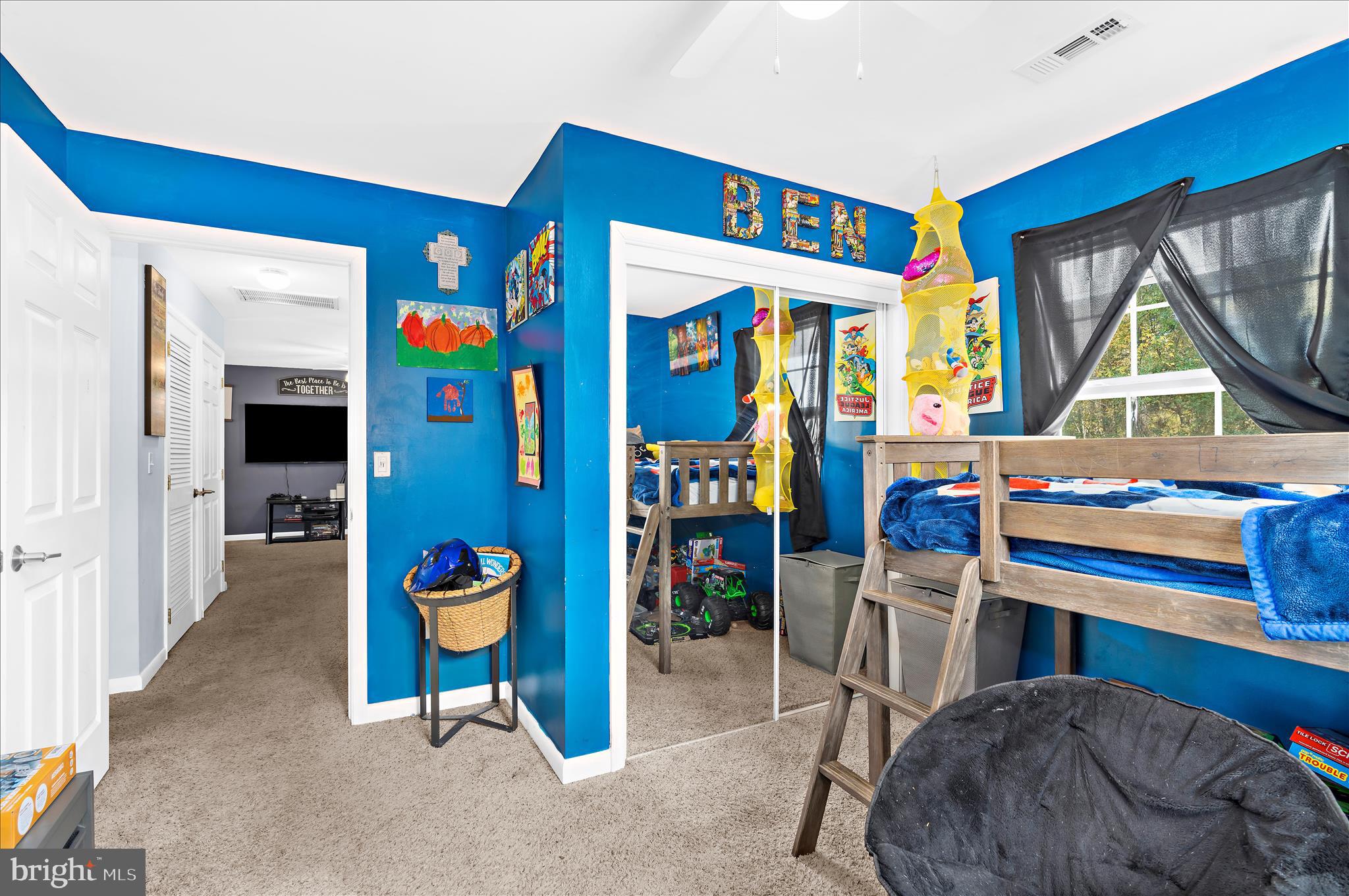 29885 Washington Road Mechanicsville, MD 20659 - Photo 11 of 32 a living room with furniture a window and a flat screen tv
