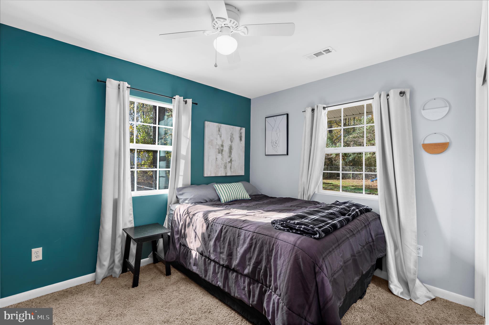 29885 Washington Road Mechanicsville, MD 20659 - Photo 12 of 32 a bedroom with a bed and a window