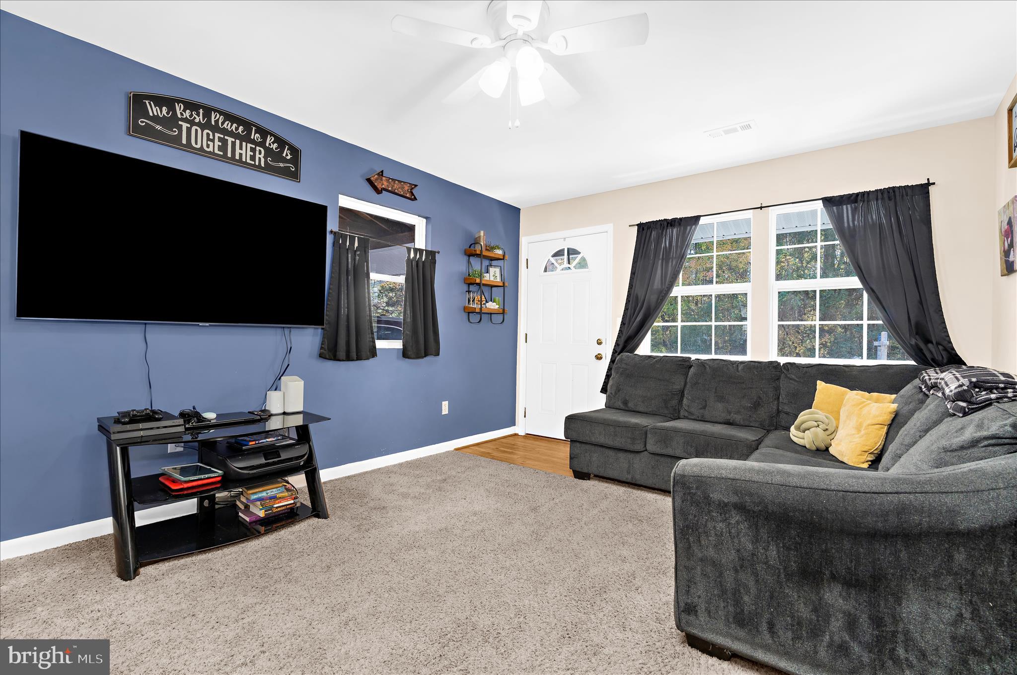 29885 Washington Road Mechanicsville, MD 20659 - Photo 3 of 32 a living room with furniture and a flat screen tv