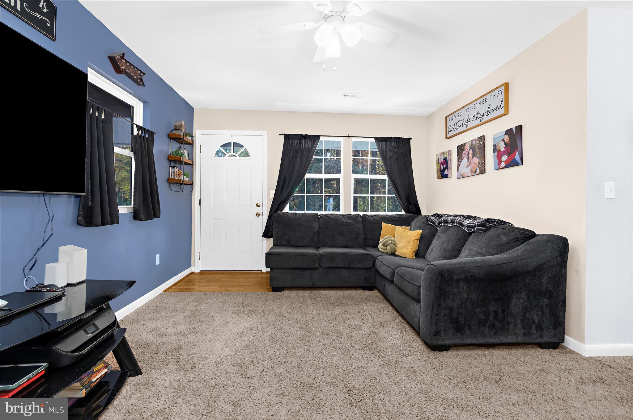29885 Washington Road Mechanicsville, MD 20659 - Photo 4 of 32 a living room with furniture and a flat screen tv