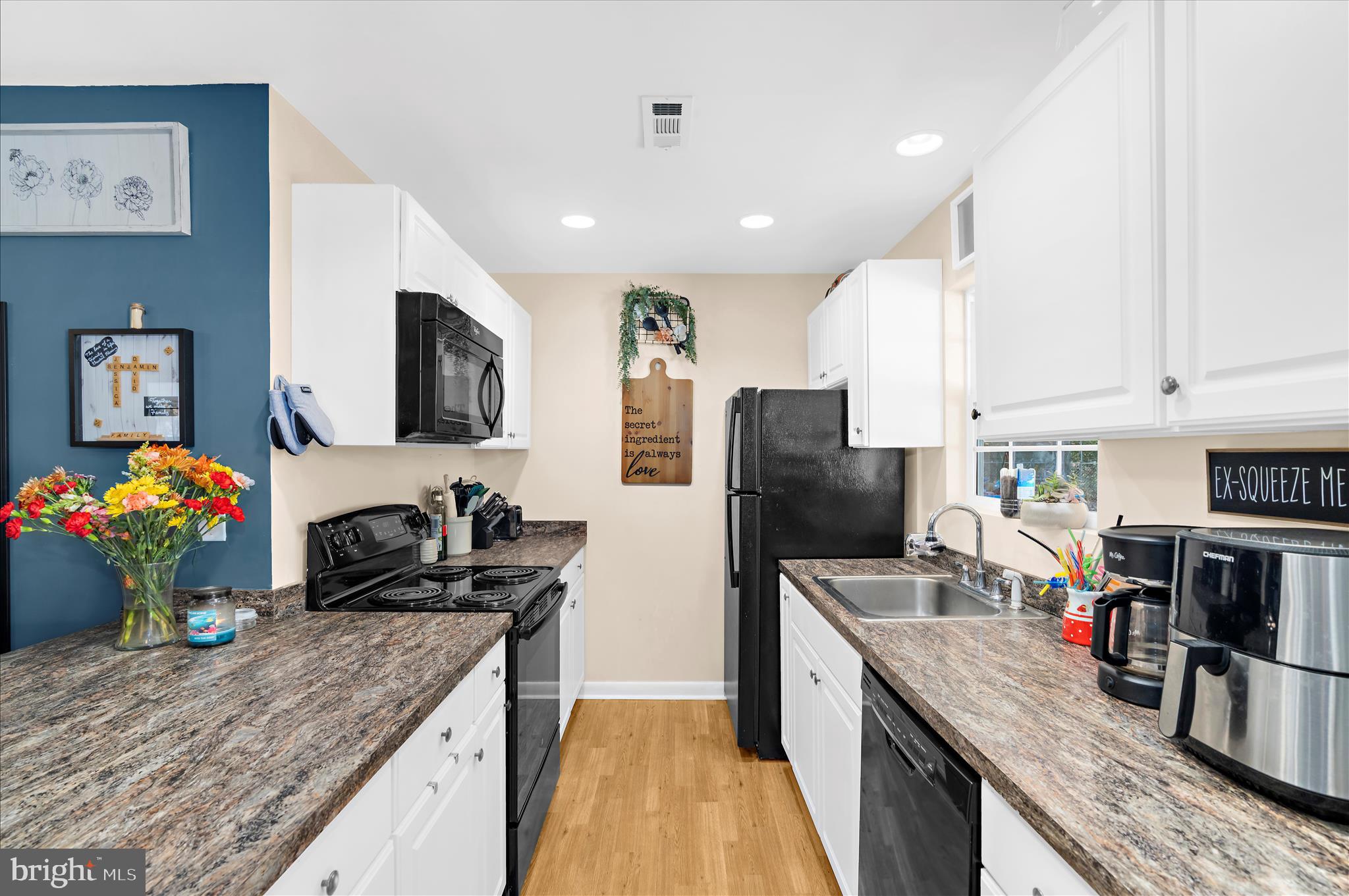 29885 Washington Road Mechanicsville, MD 20659 - Photo 5 of 32 a kitchen with stainless steel appliances granite countertop a sink stove and refrigerator