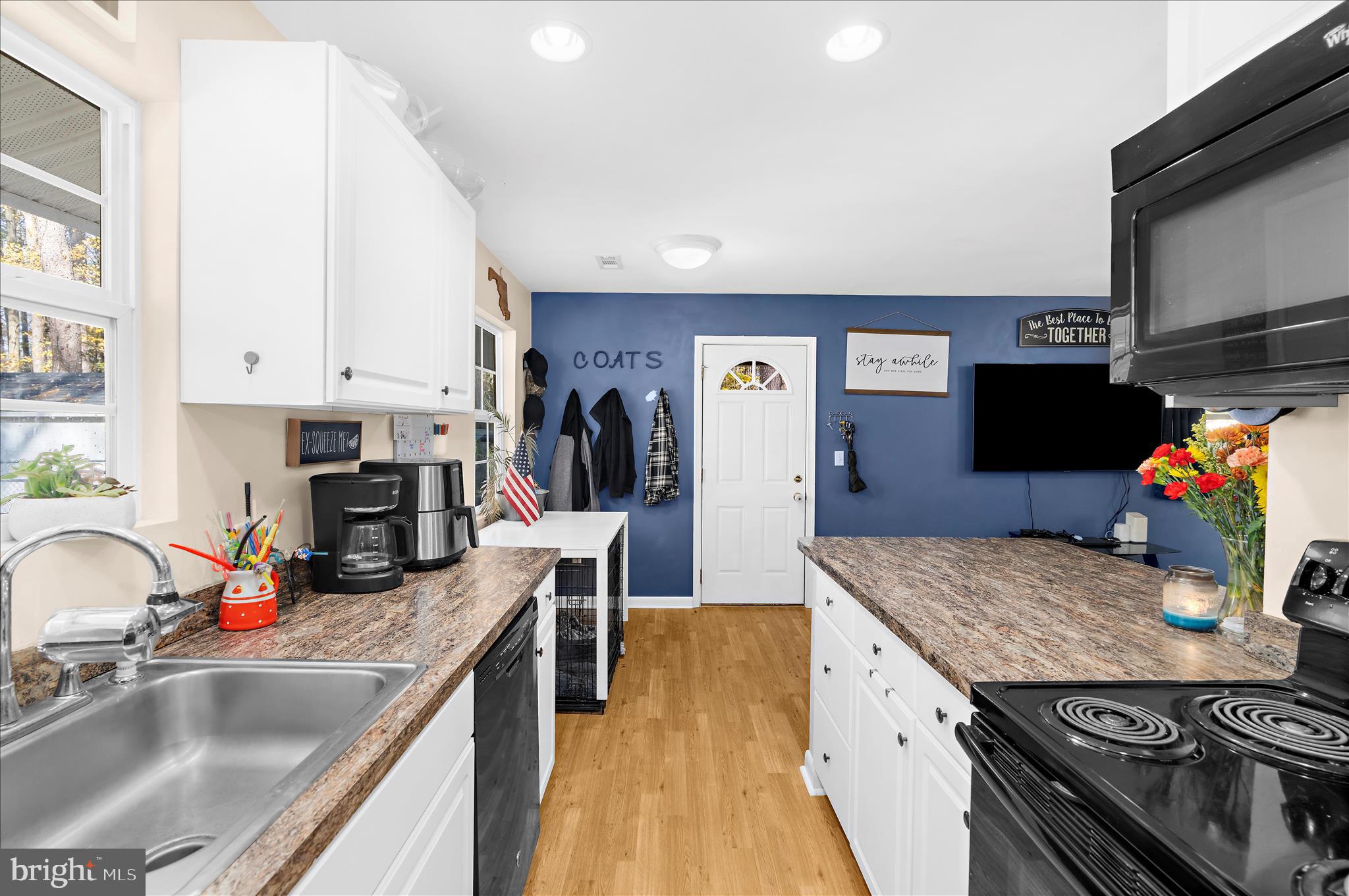 29885 Washington Road Mechanicsville, MD 20659 - Photo 6 of 32 a kitchen with stainless steel appliances granite countertop a sink stove and refrigerator