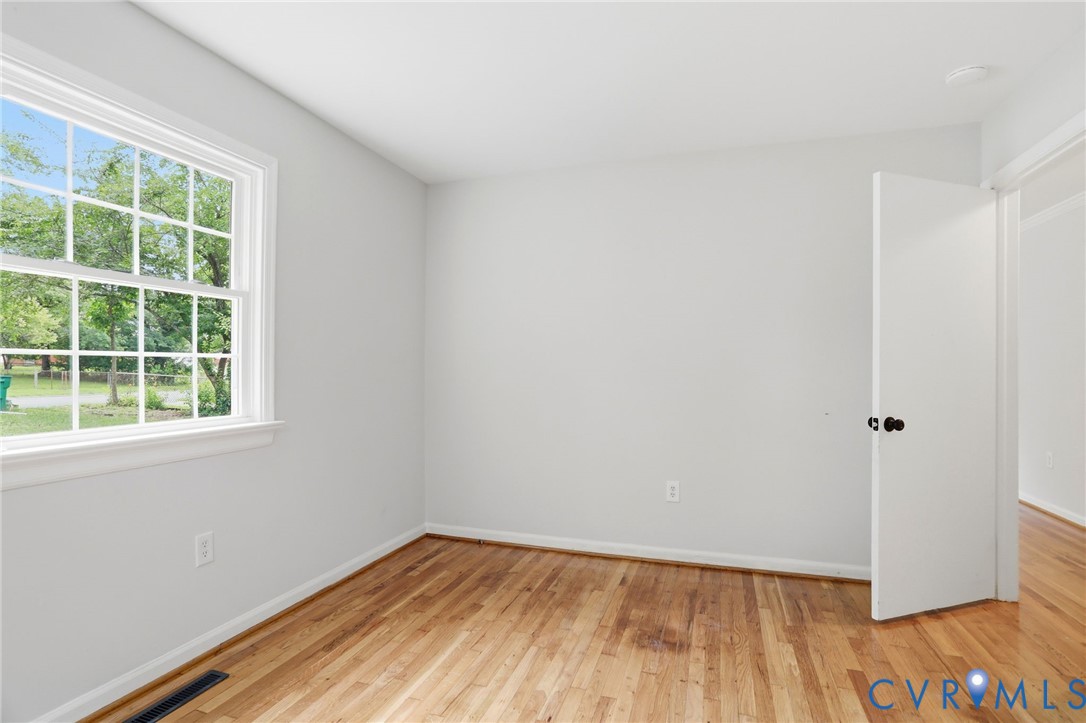 5301 Dalglish Road Richmond, VA 23223 - Photo 23 of 42 Light-filled room featuring wood-finish flooring,