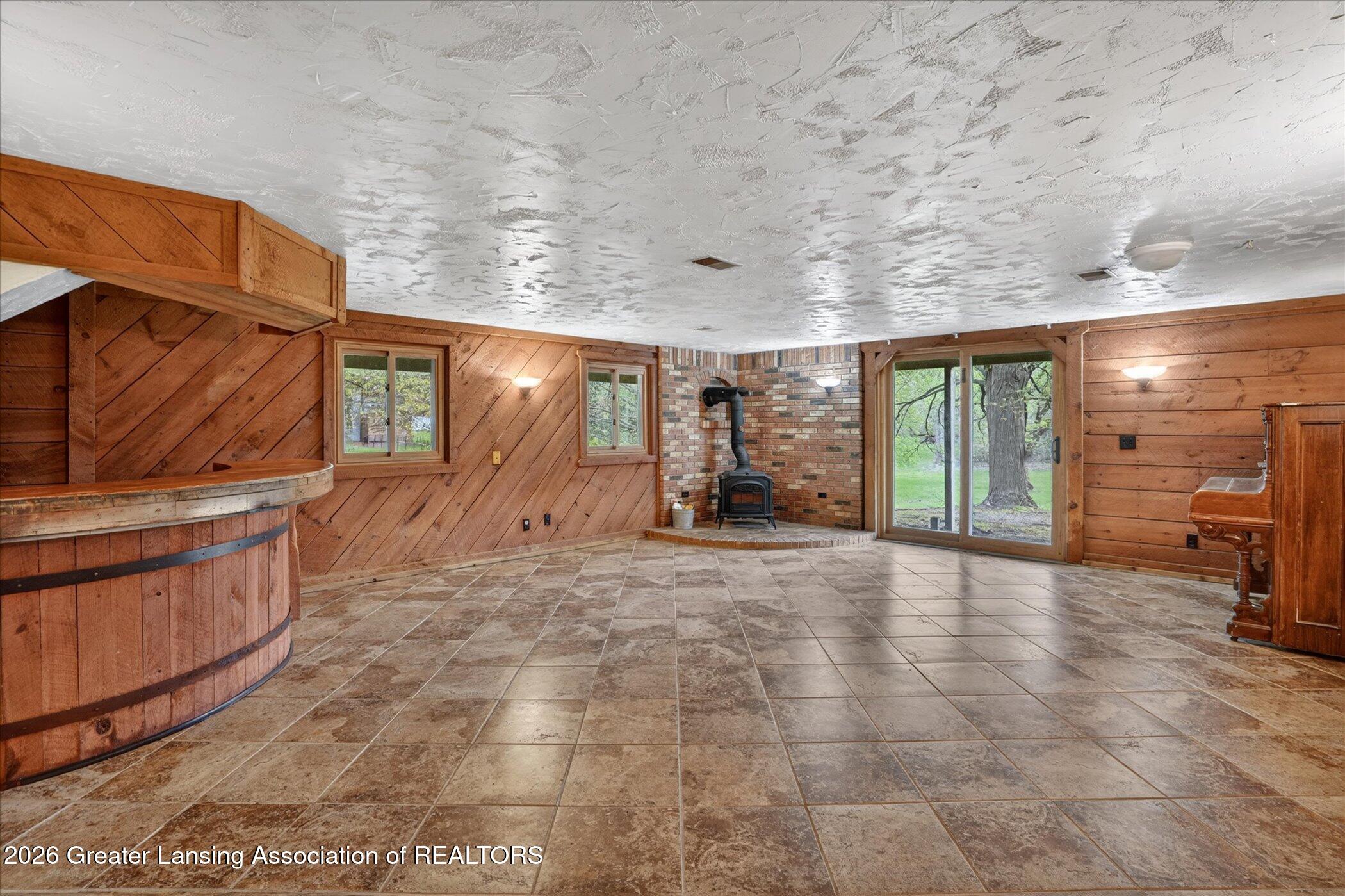 12830 Upton Road Bath, MI 48808 - Photo 25 of 38 Basement Family Room