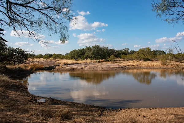 a view of a city with mountains in the background