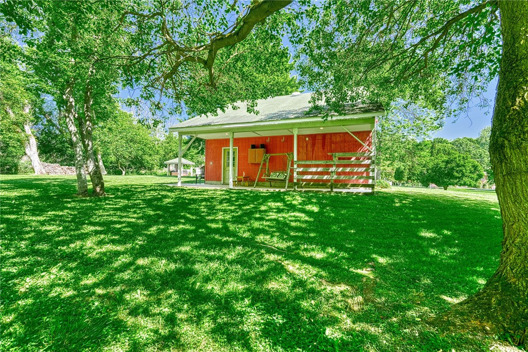 956 Willits Road Ontario, NY 14519 - Photo 37 of 50 backside of the garage/barn has a covered concrete