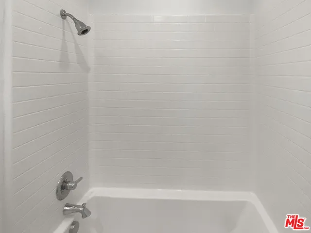 a bathroom with a sink toilet and mirror