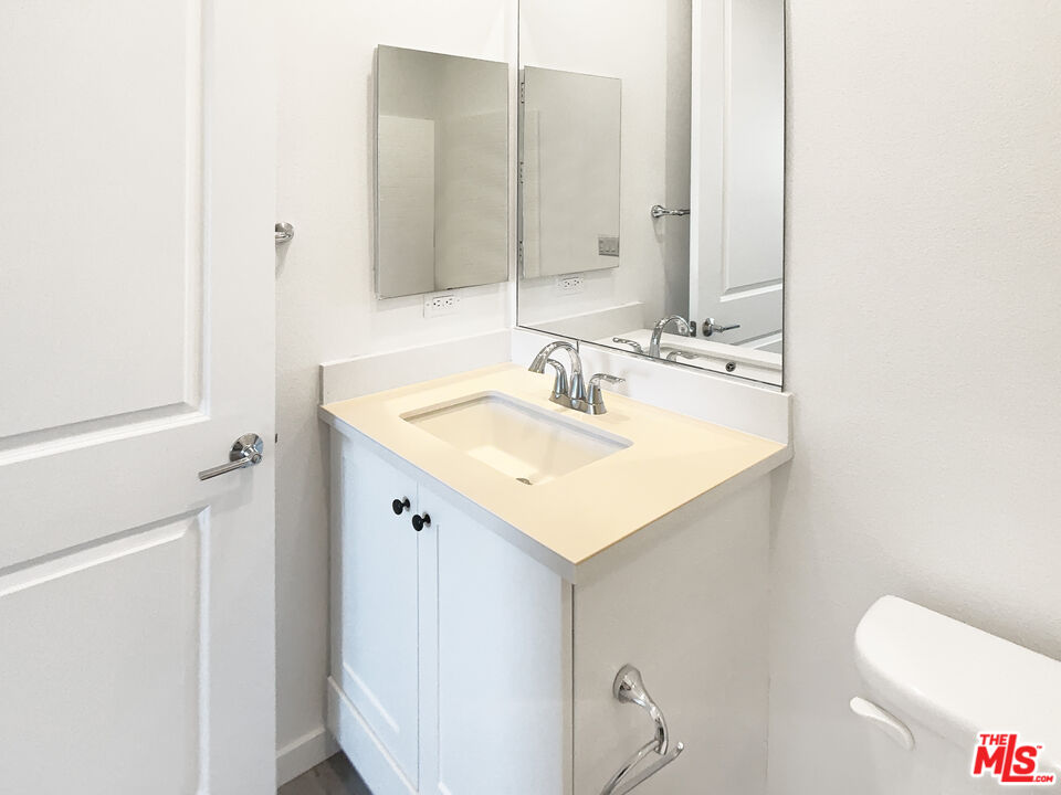 96 Marisol Street Rancho Mission Viejo, CA 92694 - Photo 18 of 26 a bathroom with a sink toilet and mirror