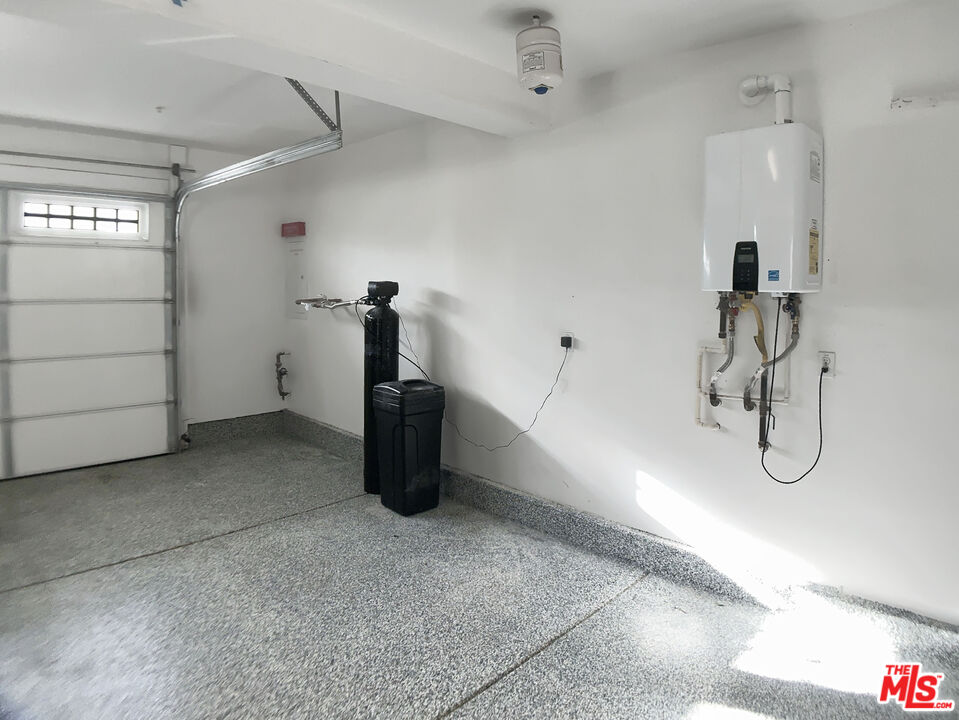 96 Marisol Street Rancho Mission Viejo, CA 92694 - Photo 24 of 26 a view of a storage & utility room with two washing machine