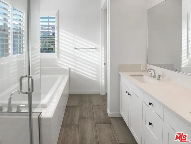 a bathroom with a bathtub and a sink