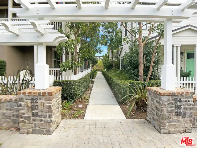a view of a patio with couches table and chairs