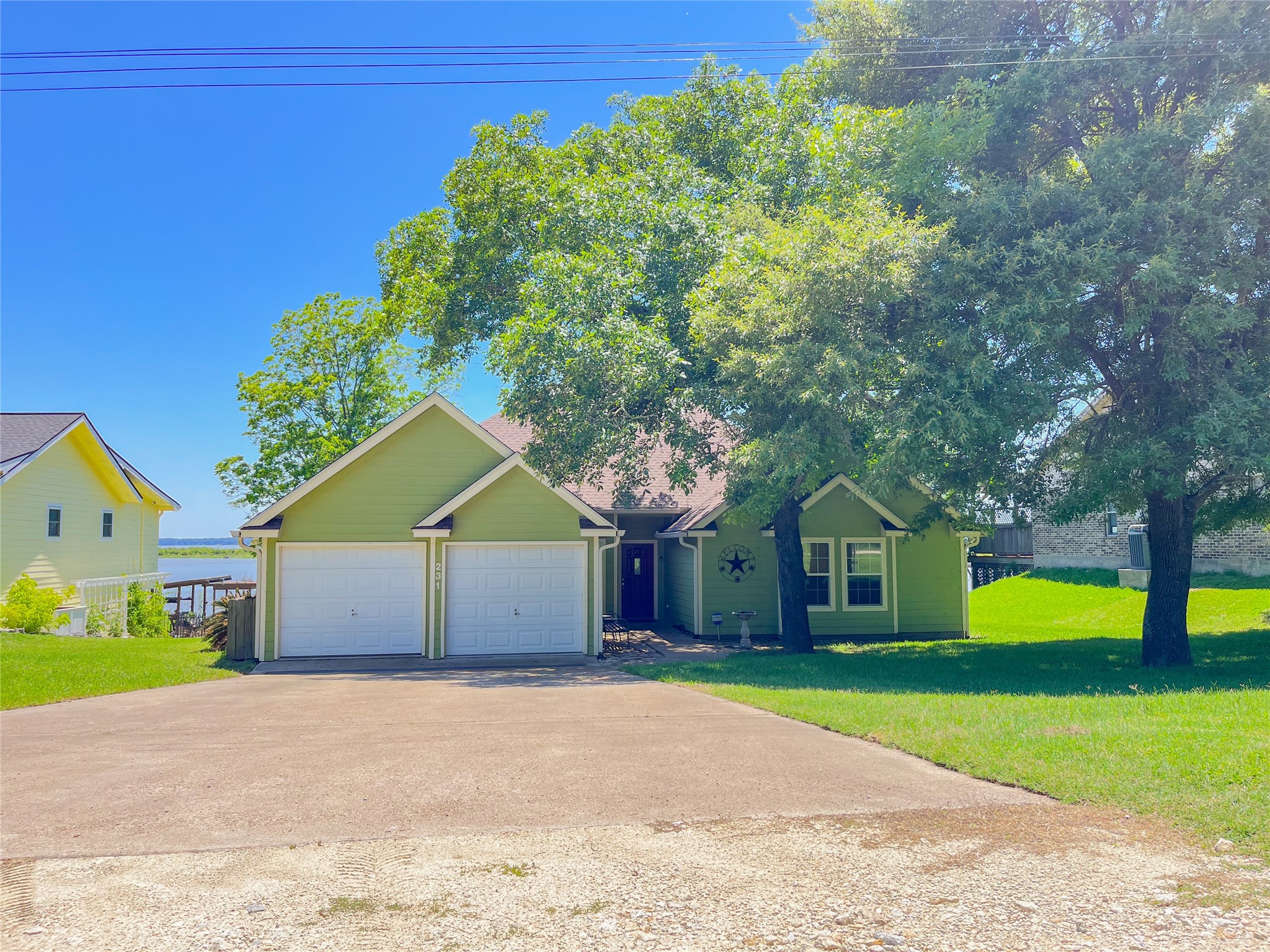 231 Memphis Belle Trinity, TX 75862 - Photo 13 of 47 a front view of a house with a garden and yard
