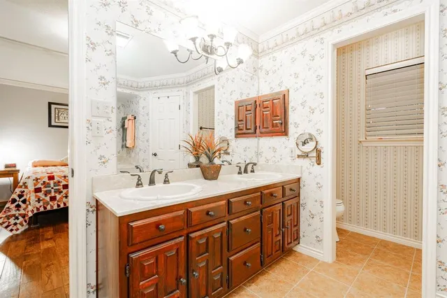 a spacious bathroom with a double vanity sink mirror and