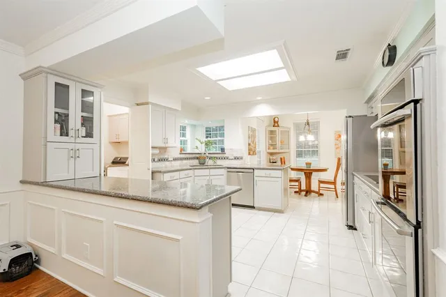a kitchen with counter top space and center island