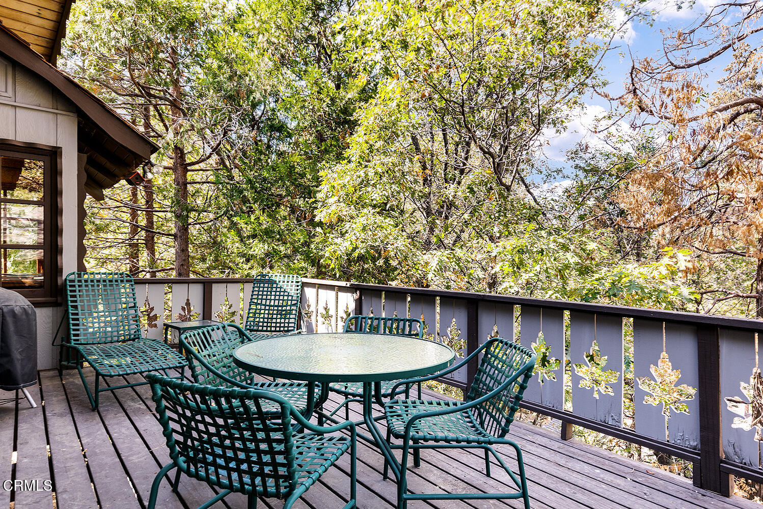 24749 Basel Drive Crestline, CA 92325 - Photo 25 of 54 a backyard of a house with table and chairs