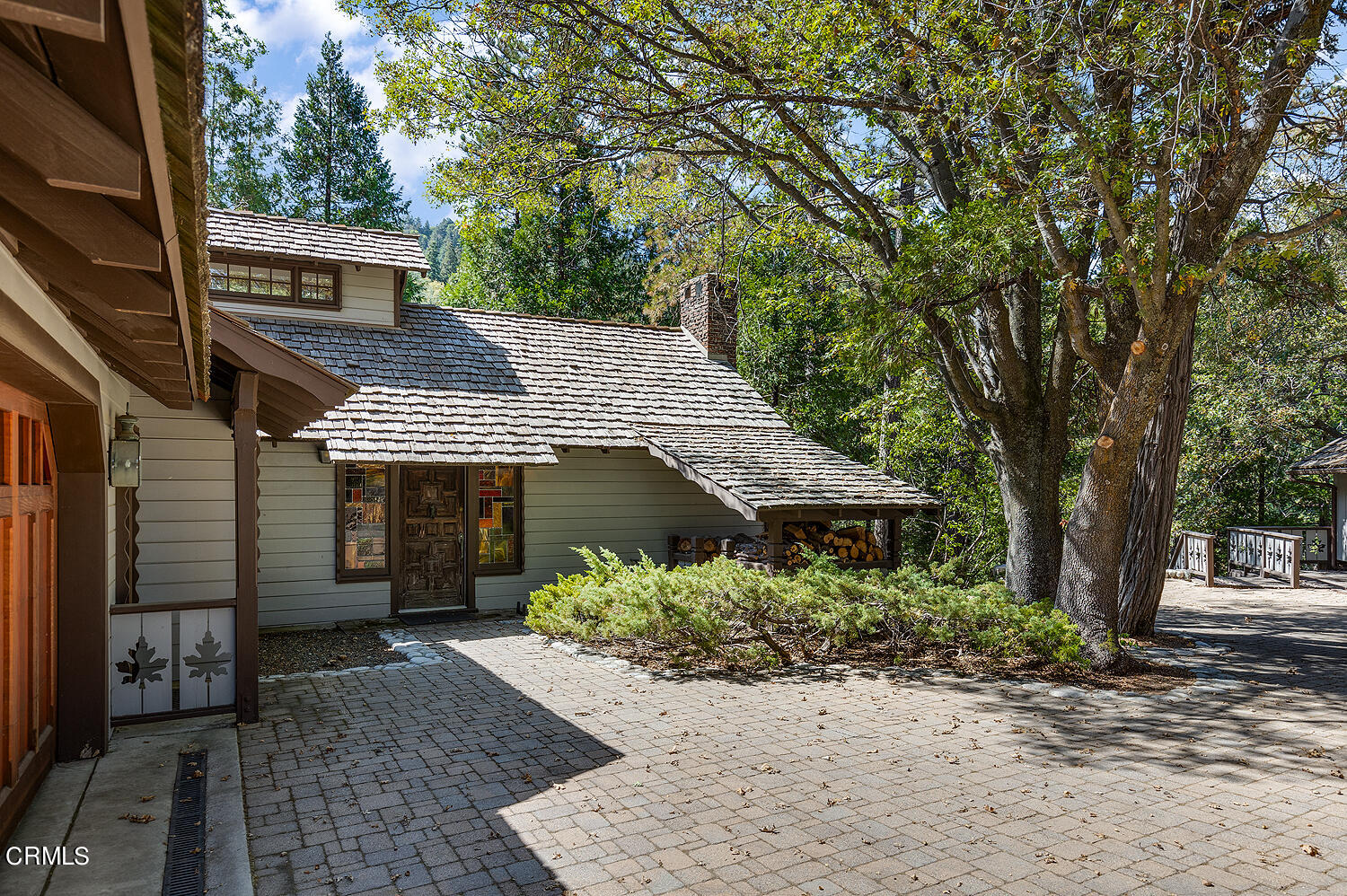24749 Basel Drive Crestline, CA 92325 - Photo 33 of 54 a front view of a house with a garden