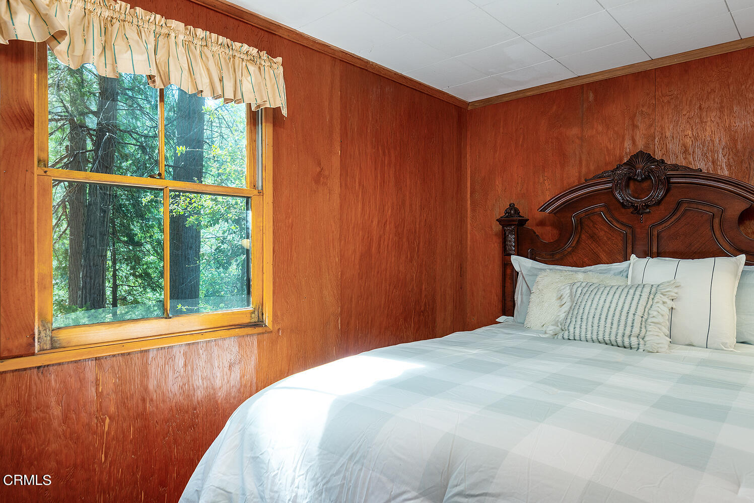24749 Basel Drive Crestline, CA 92325 - Photo 42 of 54 a bedroom with a bed and a window