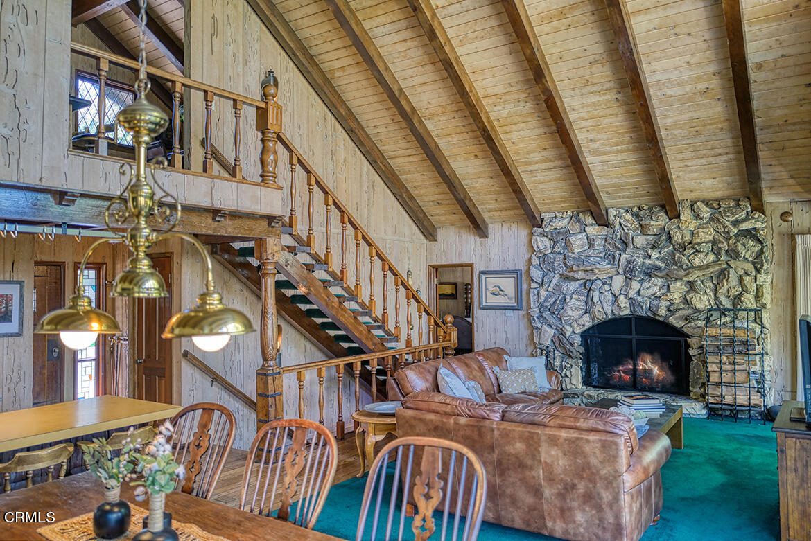 24749 Basel Drive Crestline, CA 92325 - Photo 9 of 54 a living room with fireplace furniture and a fireplace