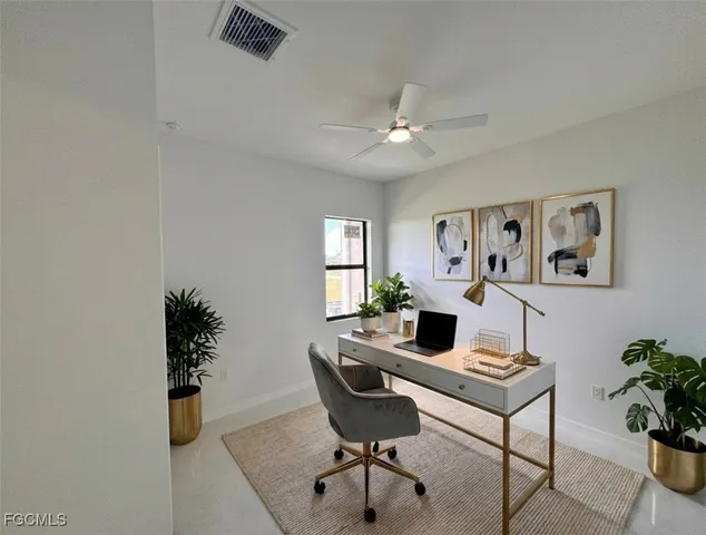 a workspace with furniture and window