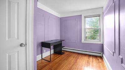 104-28 201st Street Queens, NY 11412 - Photo 8 of 13 Unfurnished bedroom featuring a baseboard radiator and wood finished floors