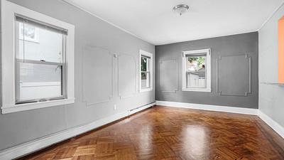 104-28 201st Street Queens, NY 11412 - Photo 10 of 13 Empty room featuring baseboard heating and baseboards