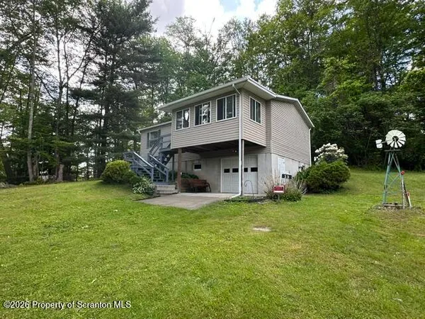 a kitchen with stainless steel appliances a refrigerator and a stove top oven