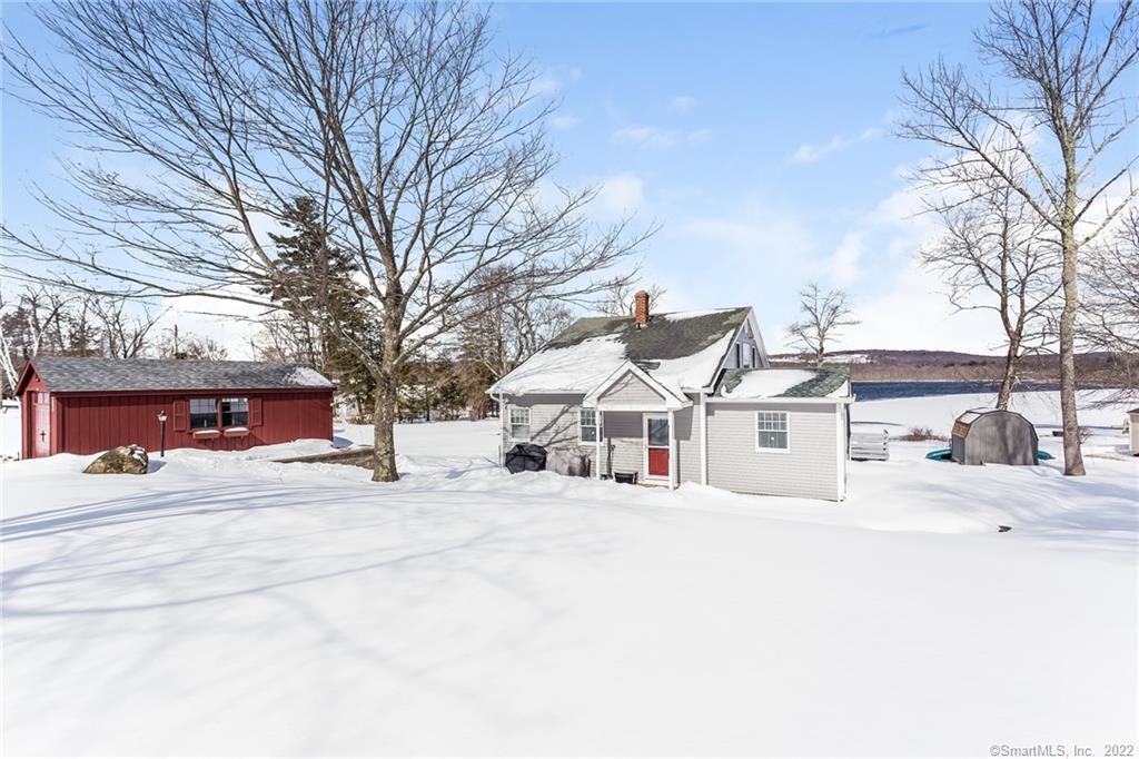58 Sandy Beach Road Goshen, CT 06756 - Photo 1 of 1 a white house that has a tree in front of it