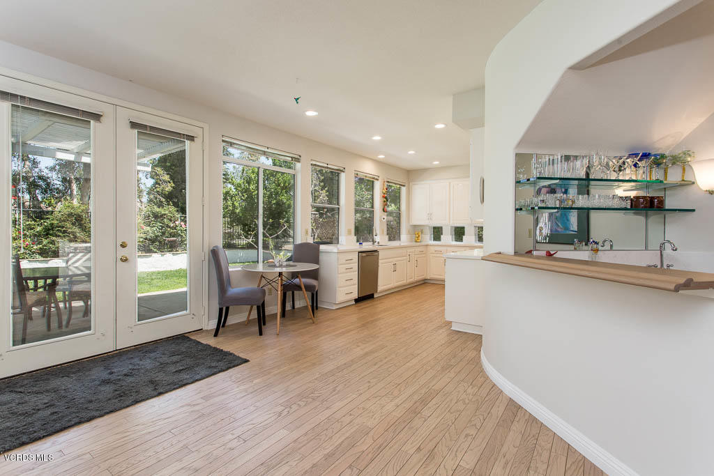 11691 Pinedale Road Moorpark, CA 93021 - Photo 11 of 37 a living room with stainless steel appliances granite countertop furniture wooden floor and a large window