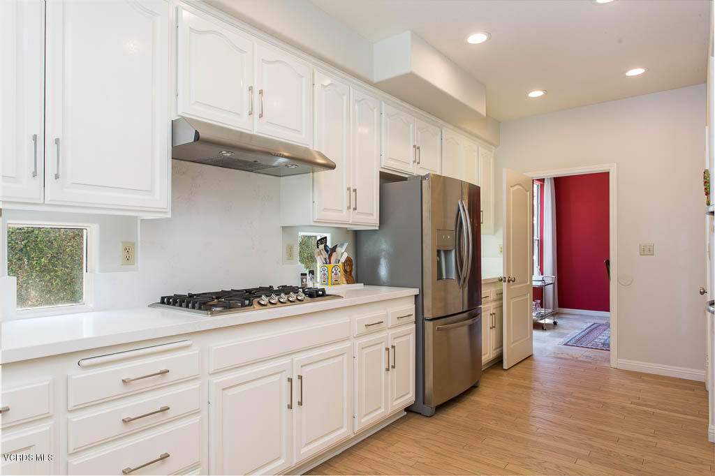 11691 Pinedale Road Moorpark, CA 93021 - Photo 14 of 37 a kitchen with stainless steel appliances granite countertop a refrigerator sink and cabinets