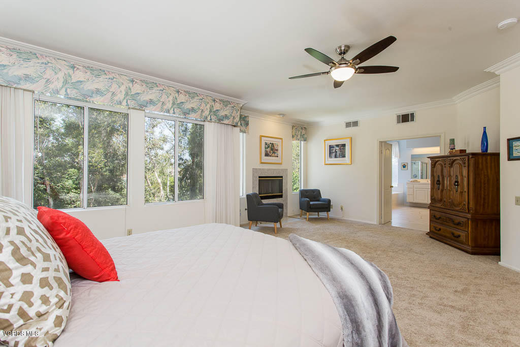 11691 Pinedale Road Moorpark, CA 93021 - Photo 18 of 37 a bedroom with a bed and dresser with wooden floor
