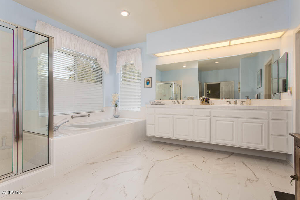 11691 Pinedale Road Moorpark, CA 93021 - Photo 19 of 37 a large bathroom with a double vanity sink mirror and bathtub