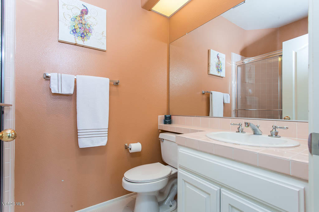11691 Pinedale Road Moorpark, CA 93021 - Photo 26 of 37 a bathroom with a sink toilet and mirror
