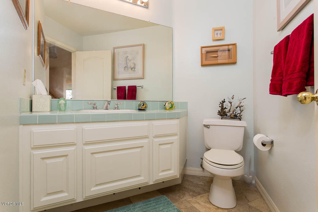11691 Pinedale Road Moorpark, CA 93021 - Photo 36 of 37 a bathroom with a toilet sink and mirror