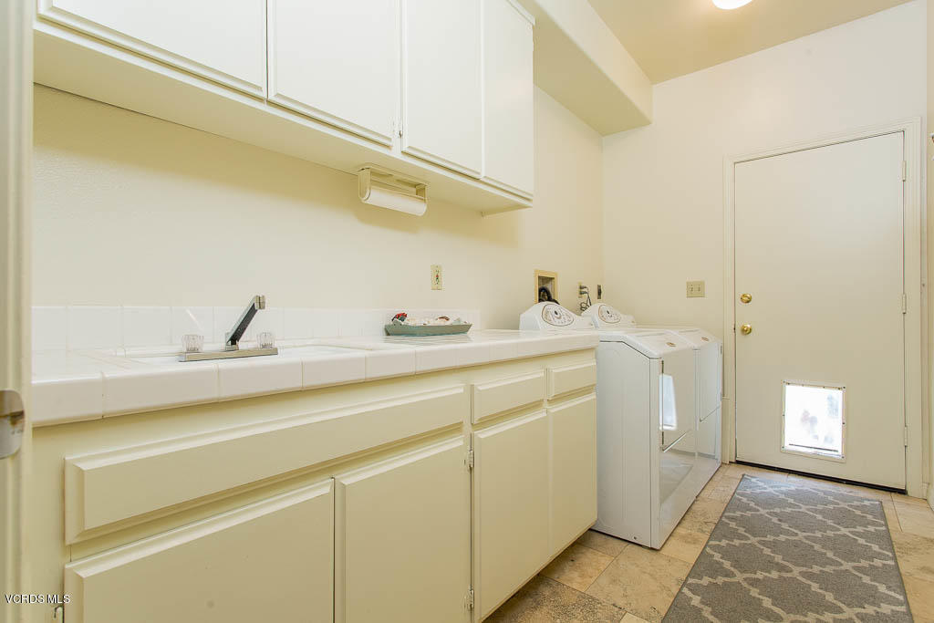 11691 Pinedale Road Moorpark, CA 93021 - Photo 37 of 37 a utility room with a sink dryer and washer