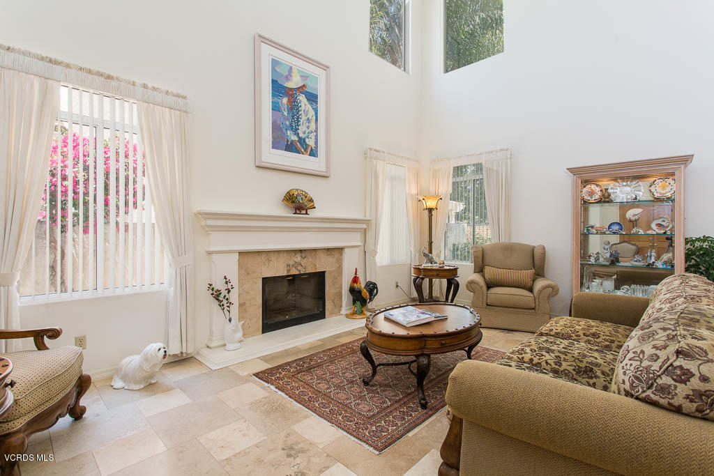 11691 Pinedale Road Moorpark, CA 93021 - Photo 6 of 37 a living room with furniture a rug and a fireplace