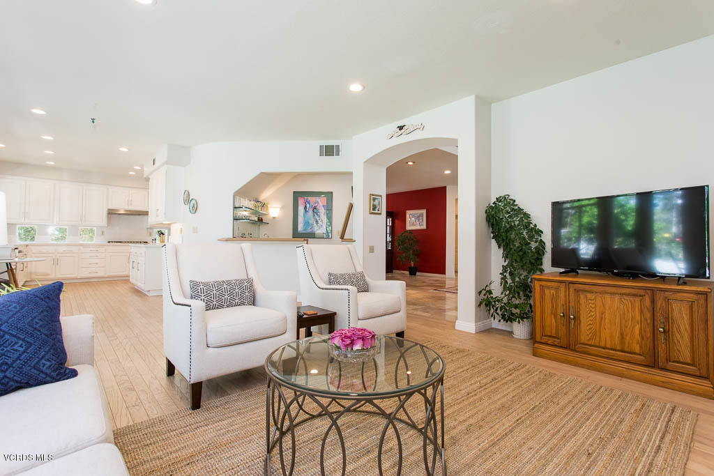 11691 Pinedale Road Moorpark, CA 93021 - Photo 10 of 37 a living room with furniture a flat screen tv and kitchen view
