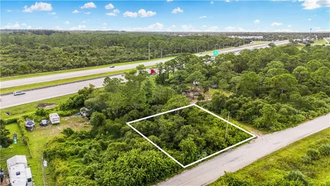 a view of a floor to ceiling window and an ocean view