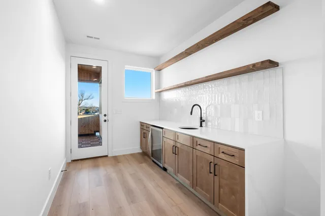 a kitchen with a sink and cabinets