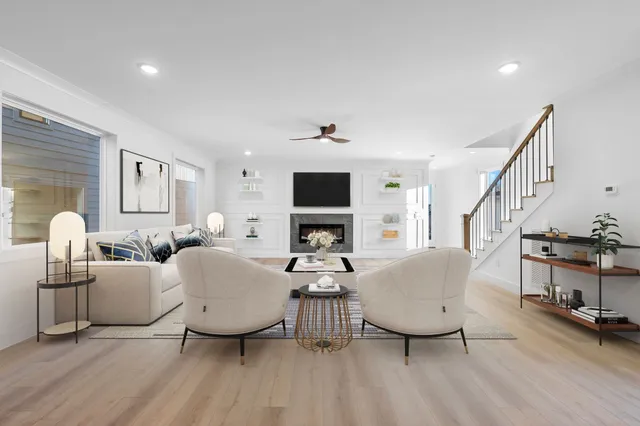 a living room with fireplace furniture and a flat screen tv