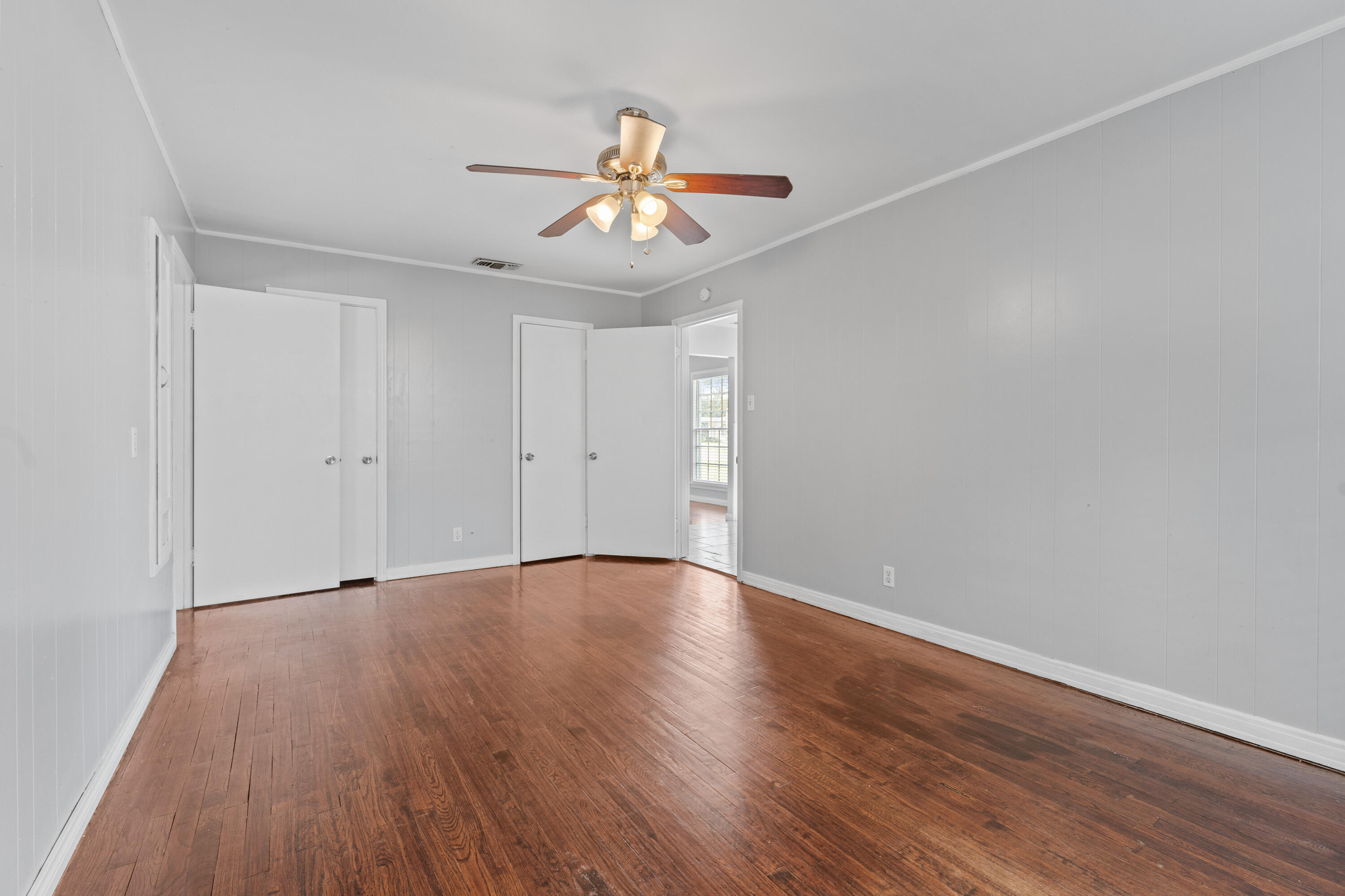 3313 26th Street Lubbock, TX 79410 - Photo 9 of 21 a view of an empty room with wooden floor