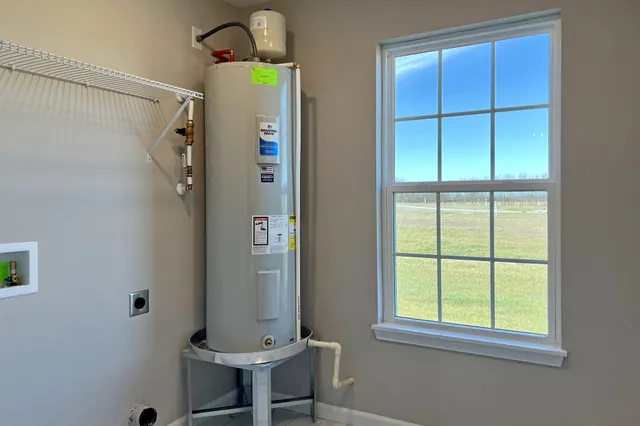 a bathroom with a window and a shower