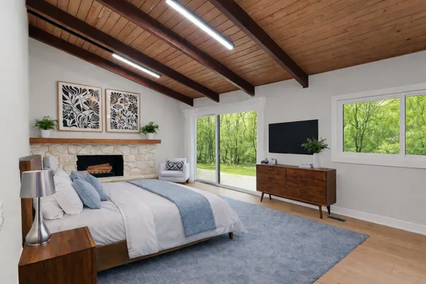 a bed room with a bed and a television