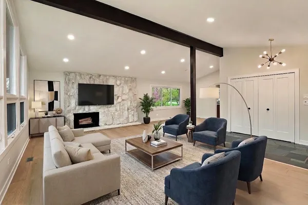 a living room with furniture and a flat screen tv