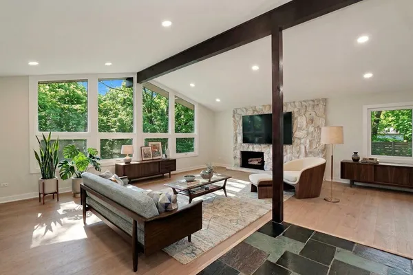 a living room with furniture and a large window